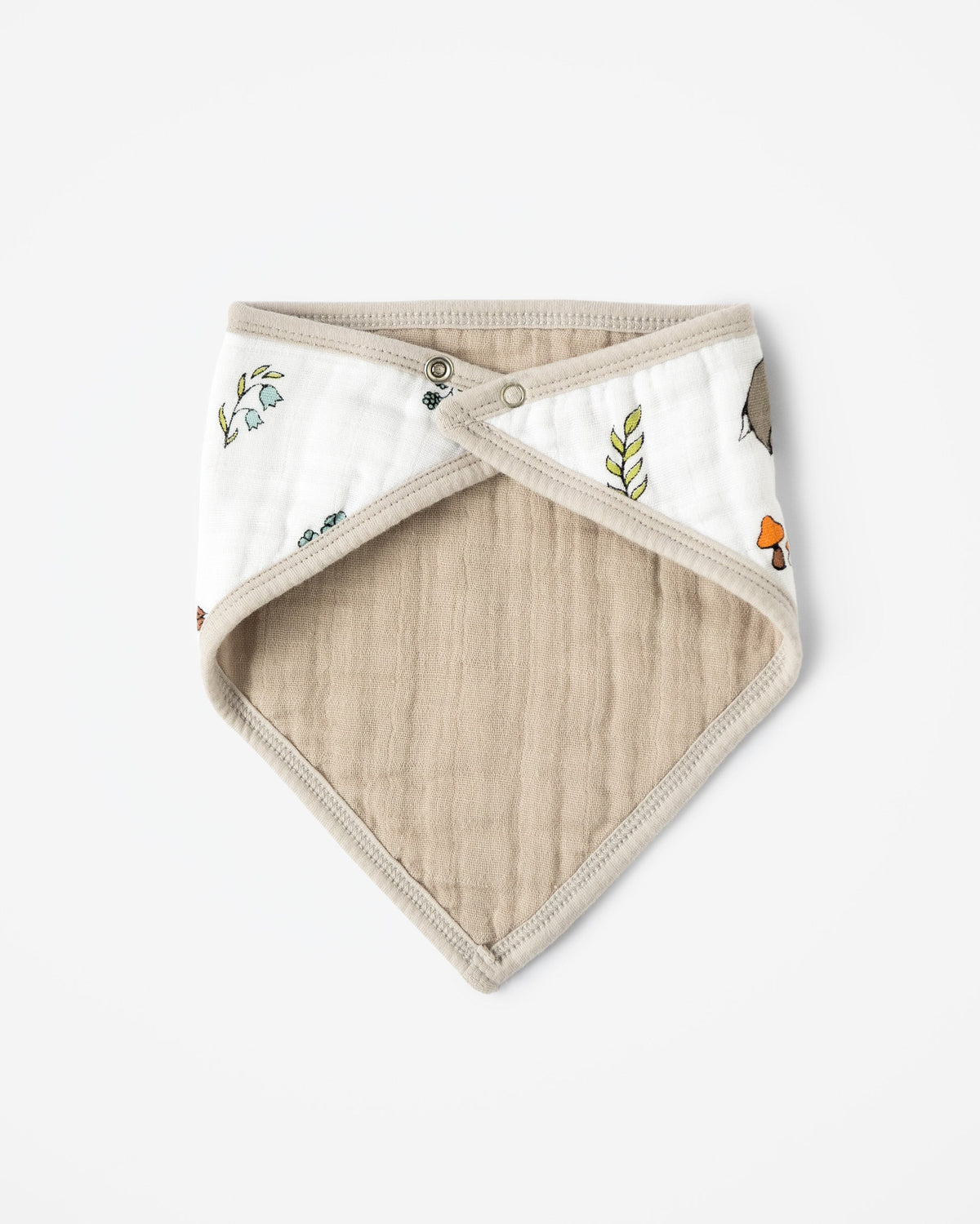 Reverse side of organic baby bandana bib with woodland pattern and single metal stud clasp