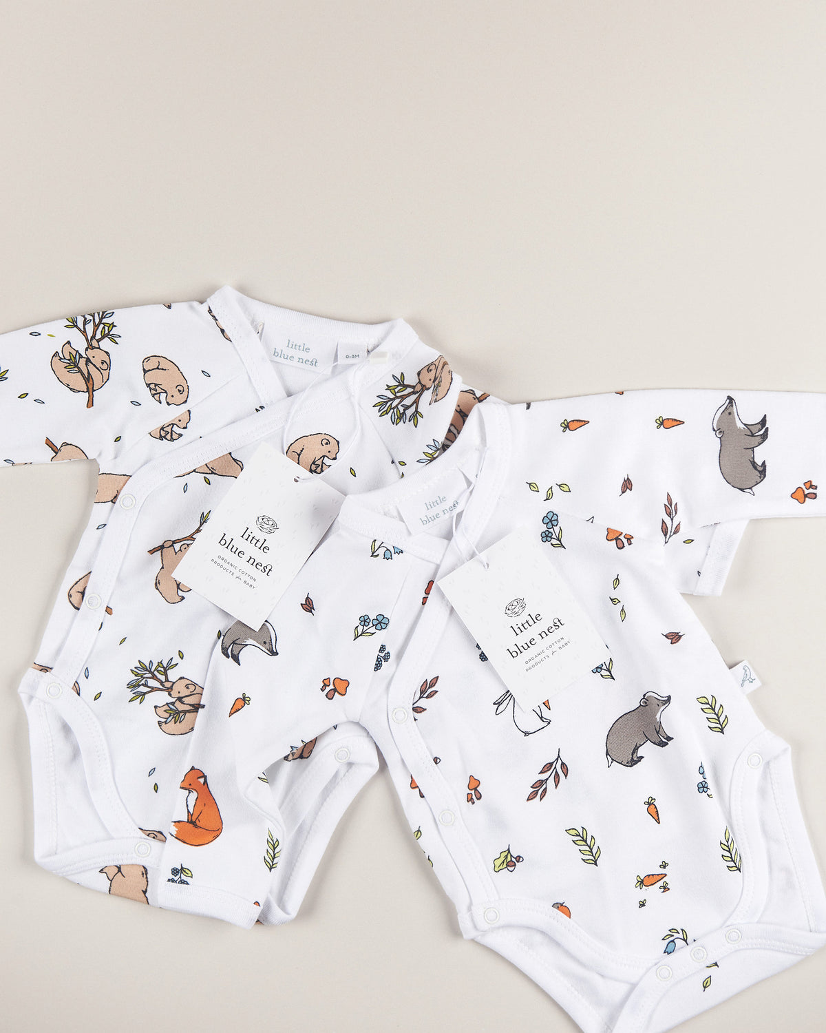 Bear cub and woodland bodysuit details with swing tag packaging