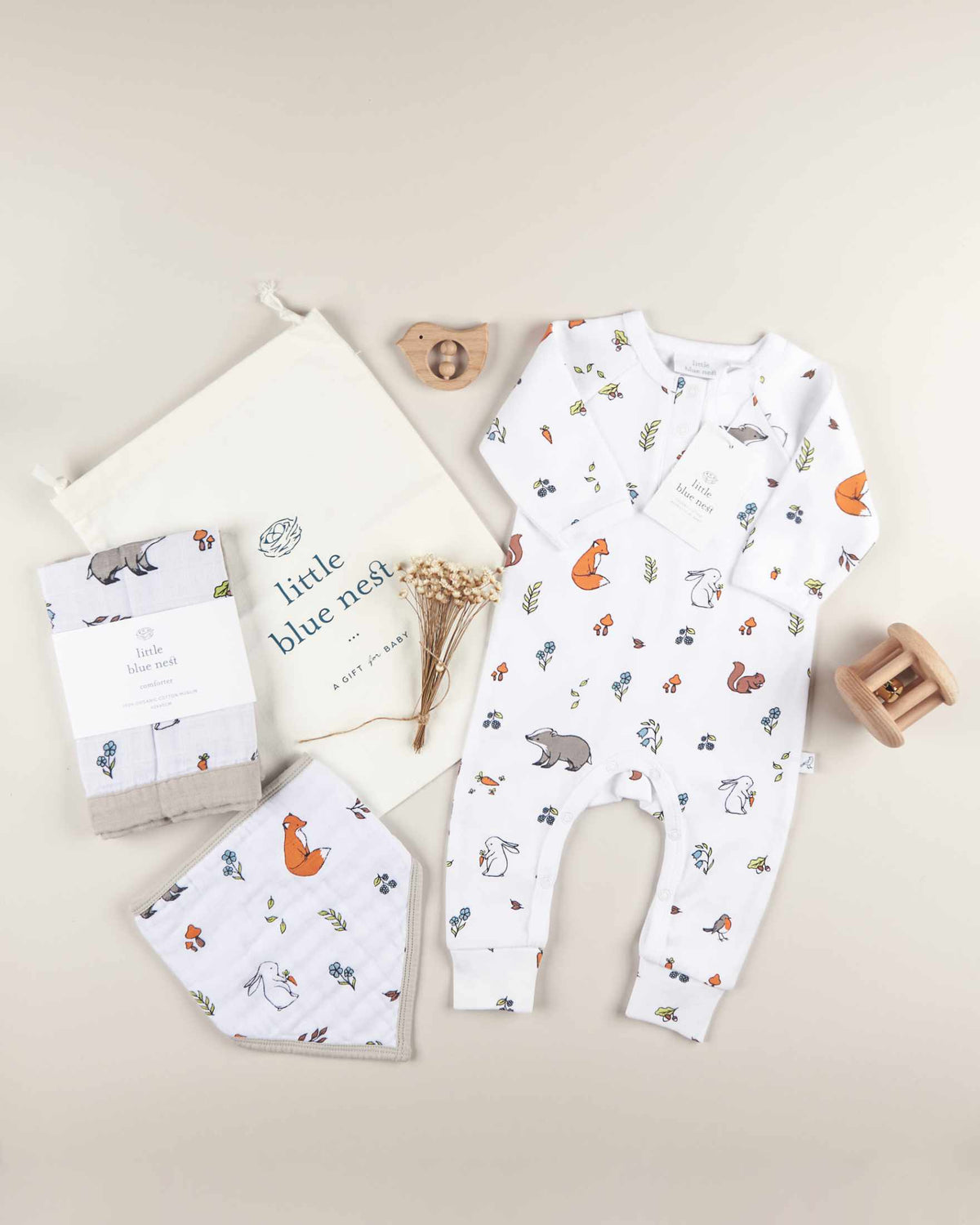 Woodland pattern flat lay example of products for baby