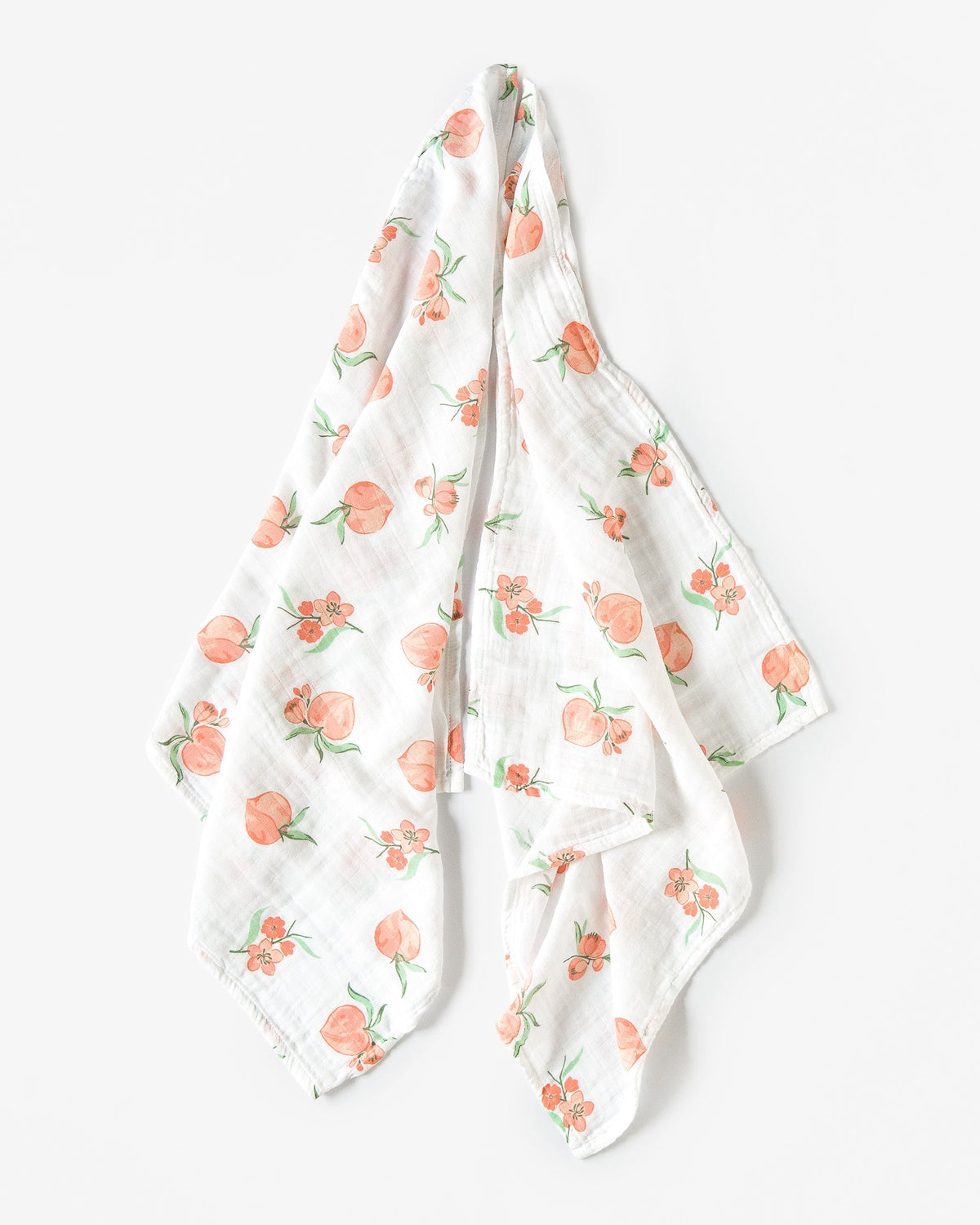 Organic cotton muslin square cloths with peach pattern draped